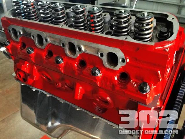GT40P cylinder heads torqued down on the red 302 block