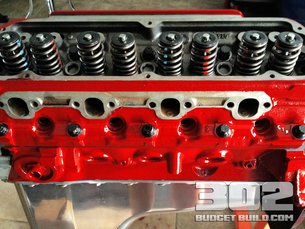 The red 302 block with both GT40P heads, valve springs and a polished oil pan installed